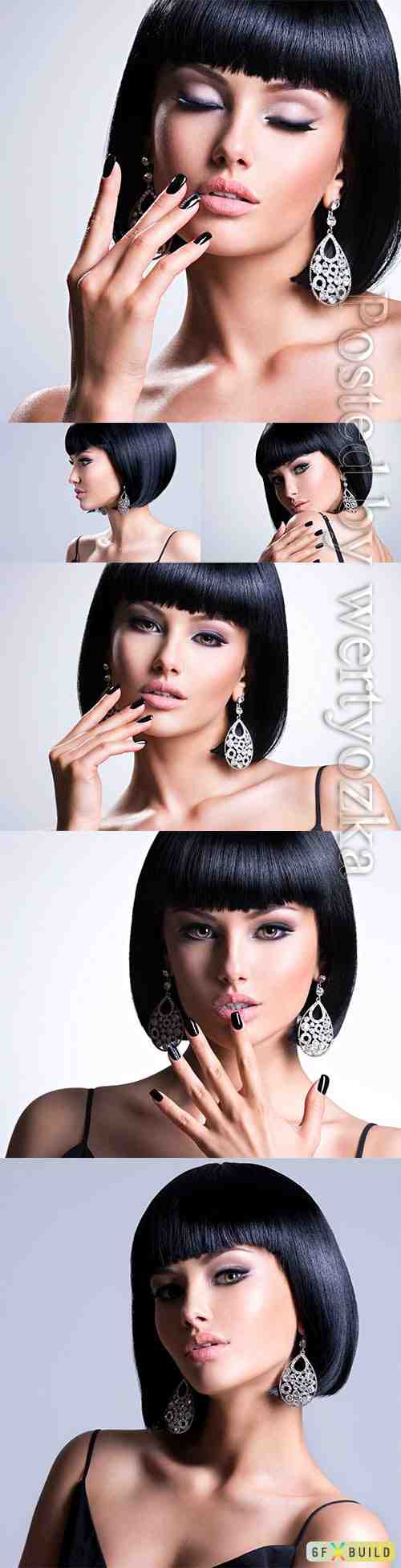 Beautiful brunet woman with black nails and fashion makeup of eyes